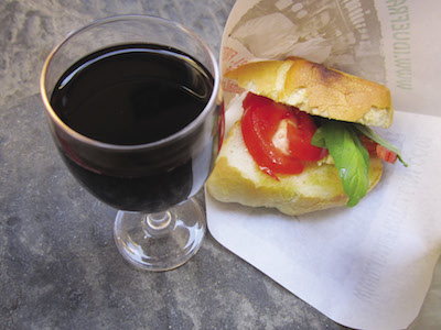 Tomato sandwich and a glass of wine