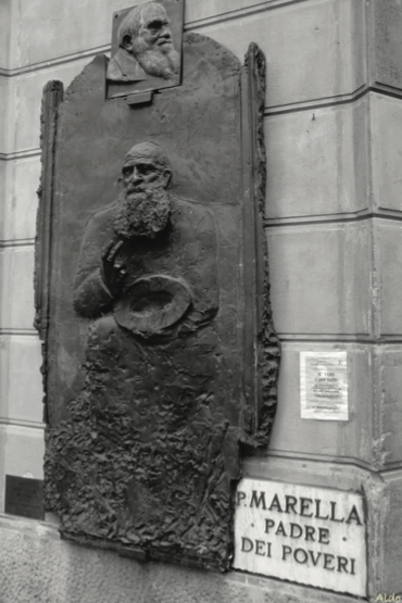 The corner of Father Marella - Via Drapperie 1, Bologna