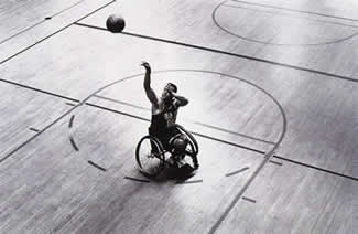 Picture of a disabled athlete playing basketball 