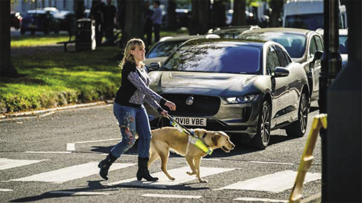 Pedestrian crossing and cars with audio sound system