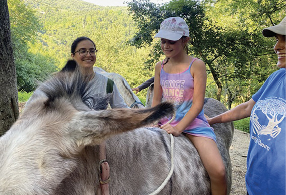 Adele riding the donkey Alice