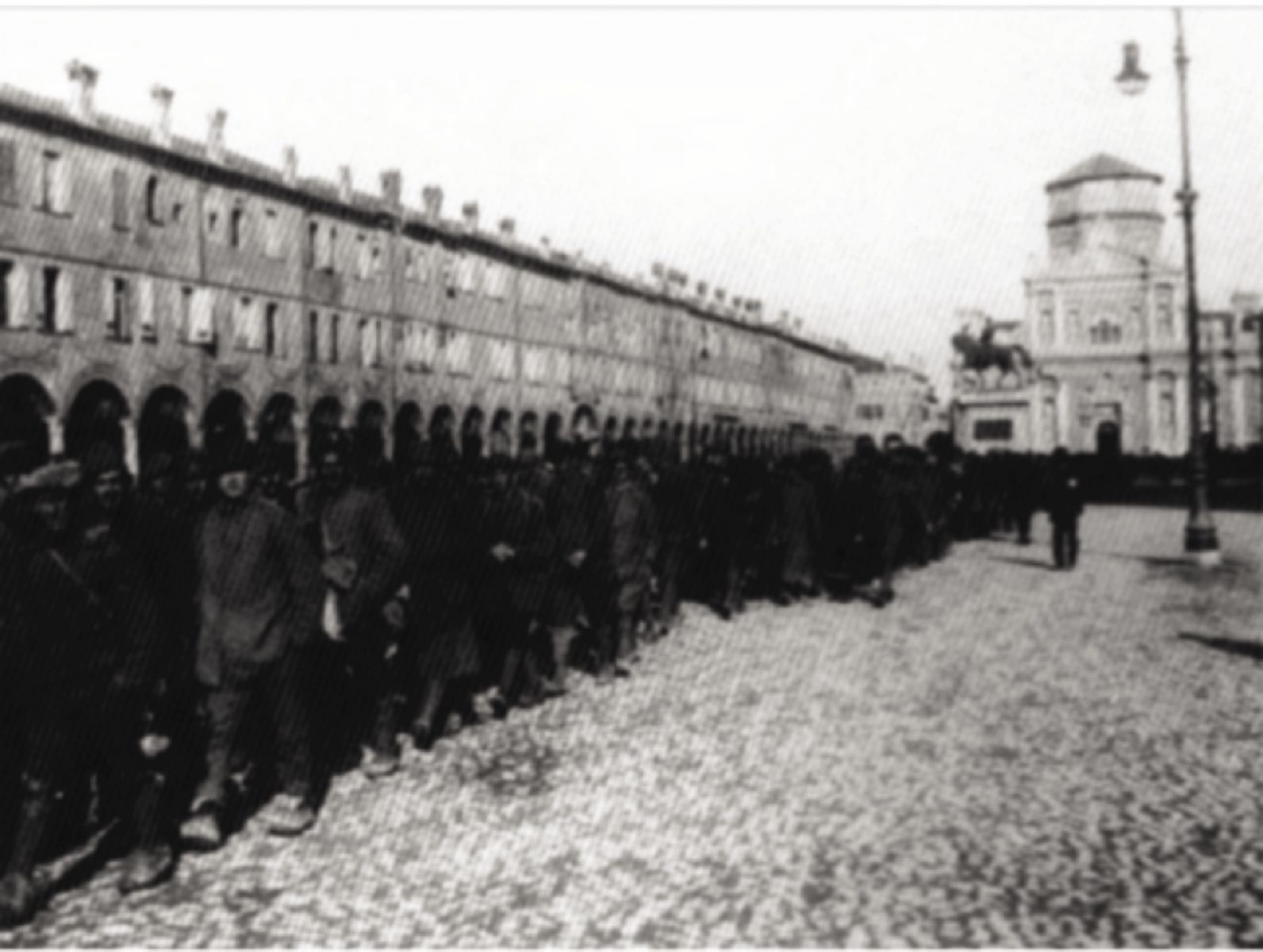 Return of veterans to Italy from the Austro-Hungarian concentration camps to be later accused of desertion.  Piazza di Carpi, December 1918