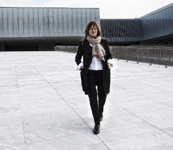 Isabella Seragnoli at the entrance to the MAST, Bologna