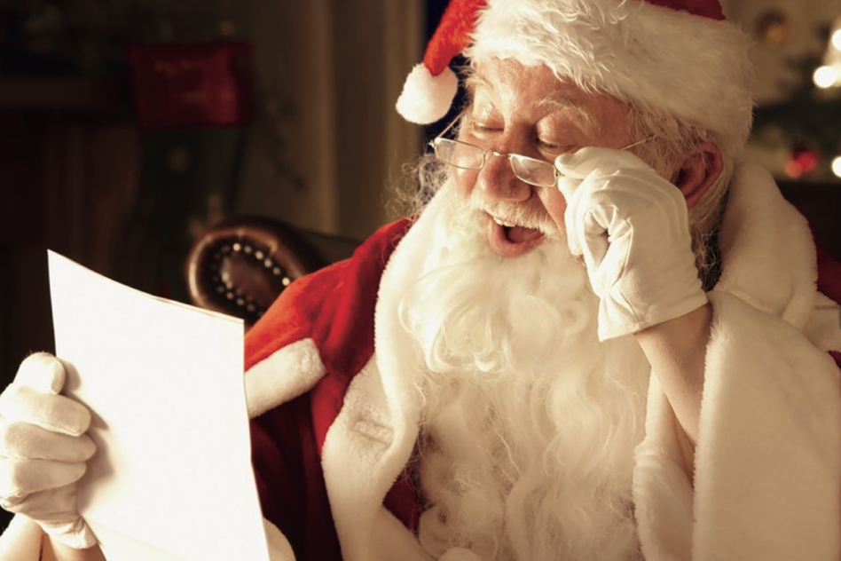 Santa Claus reading a letter