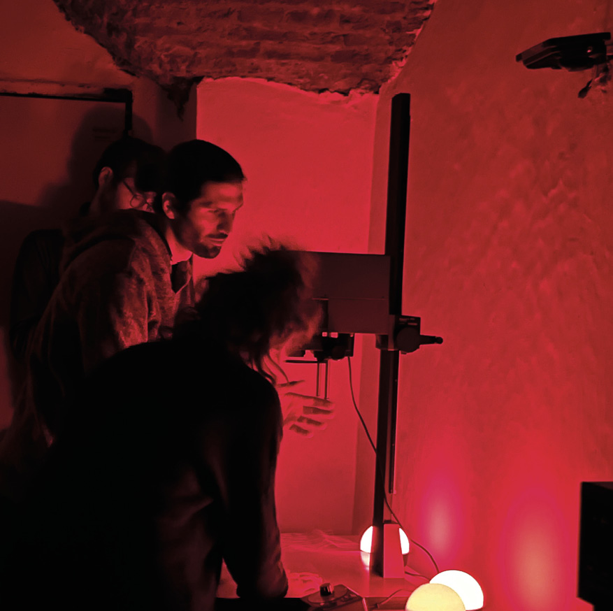 Matteo Stefani working with a photo enlarger - photo by Davide Conte