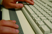 Blind person writing on a PC using a braille line 