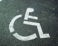 Picture - Logo of a person in a wheelchair on the asphalt