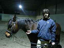 Picture - Matteo Stefani next to his horse